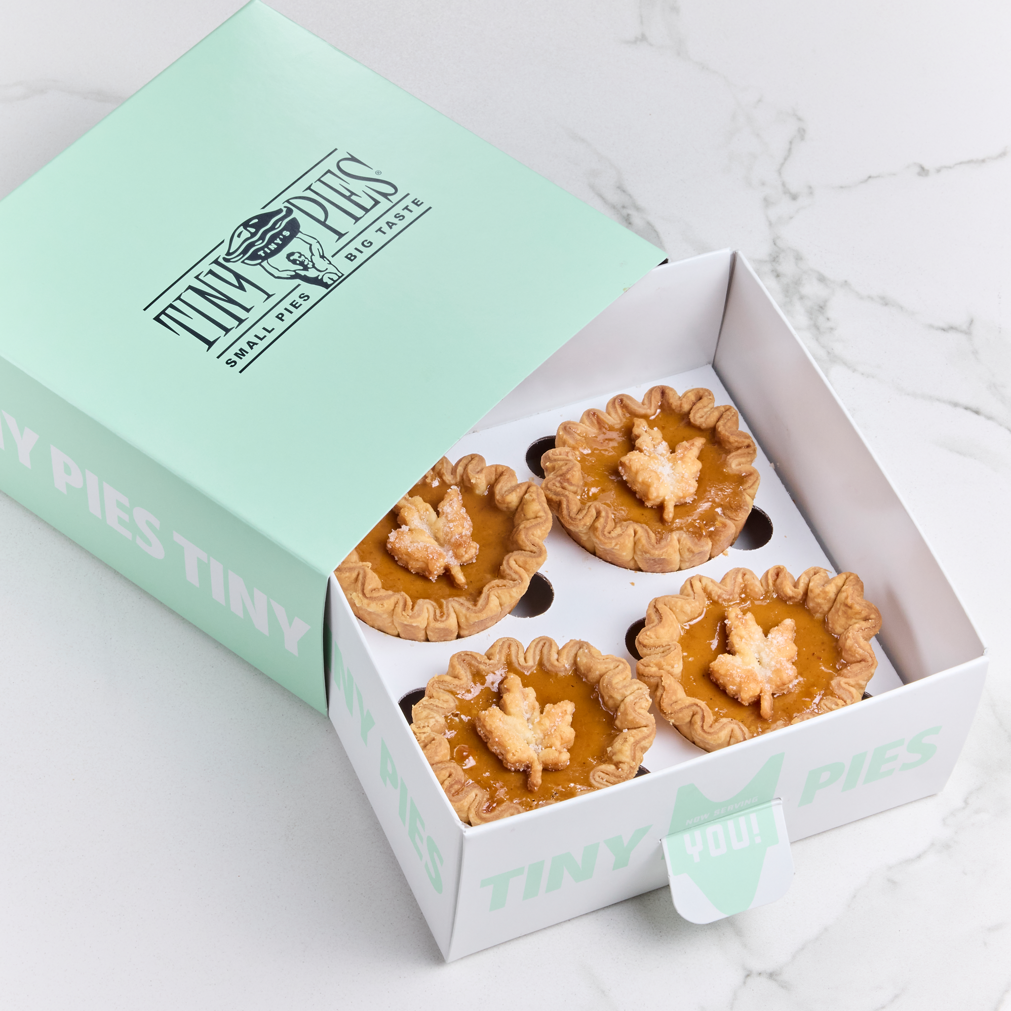 4 pumpkin mini pies in a mint green gift pack